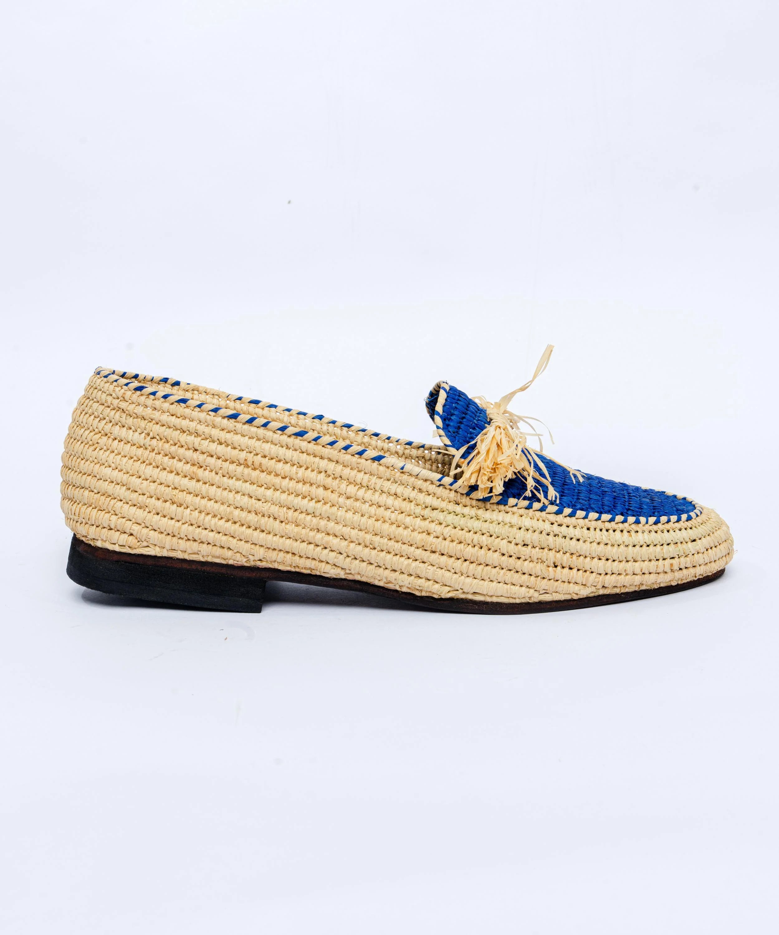 Woven loafer with blue accents on a white background