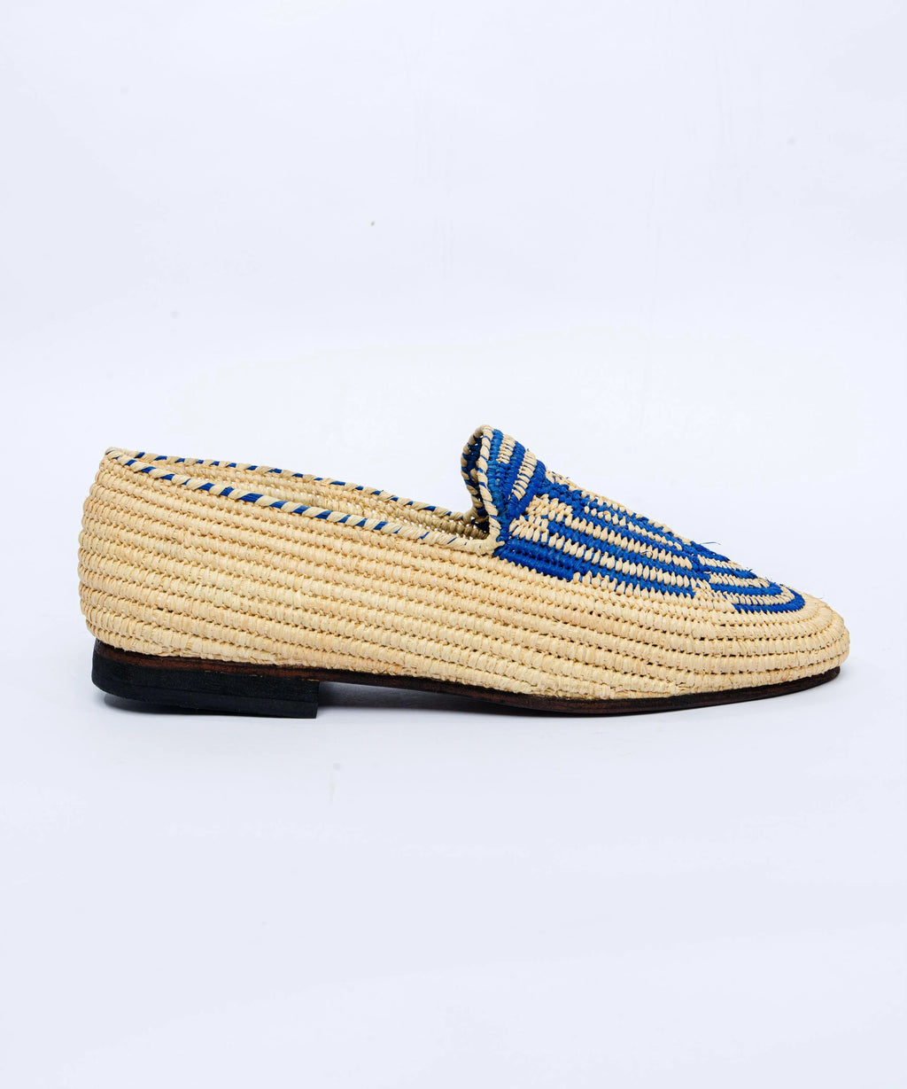 Woven loafer with blue accents on a white background