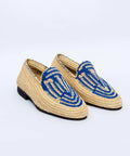 Pair of woven shoes with blue accents on a white background
