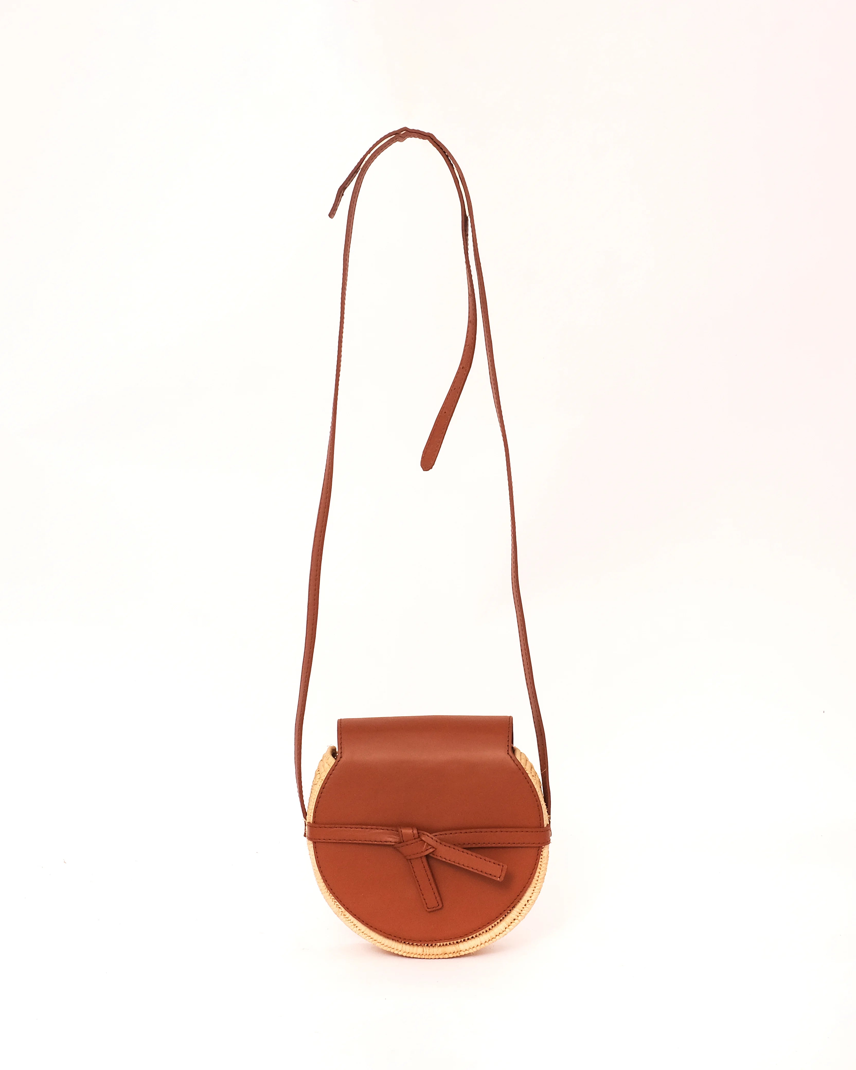 Brown leather crossbody bag on a white background