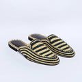 Pair of striped slippers on a light gray background