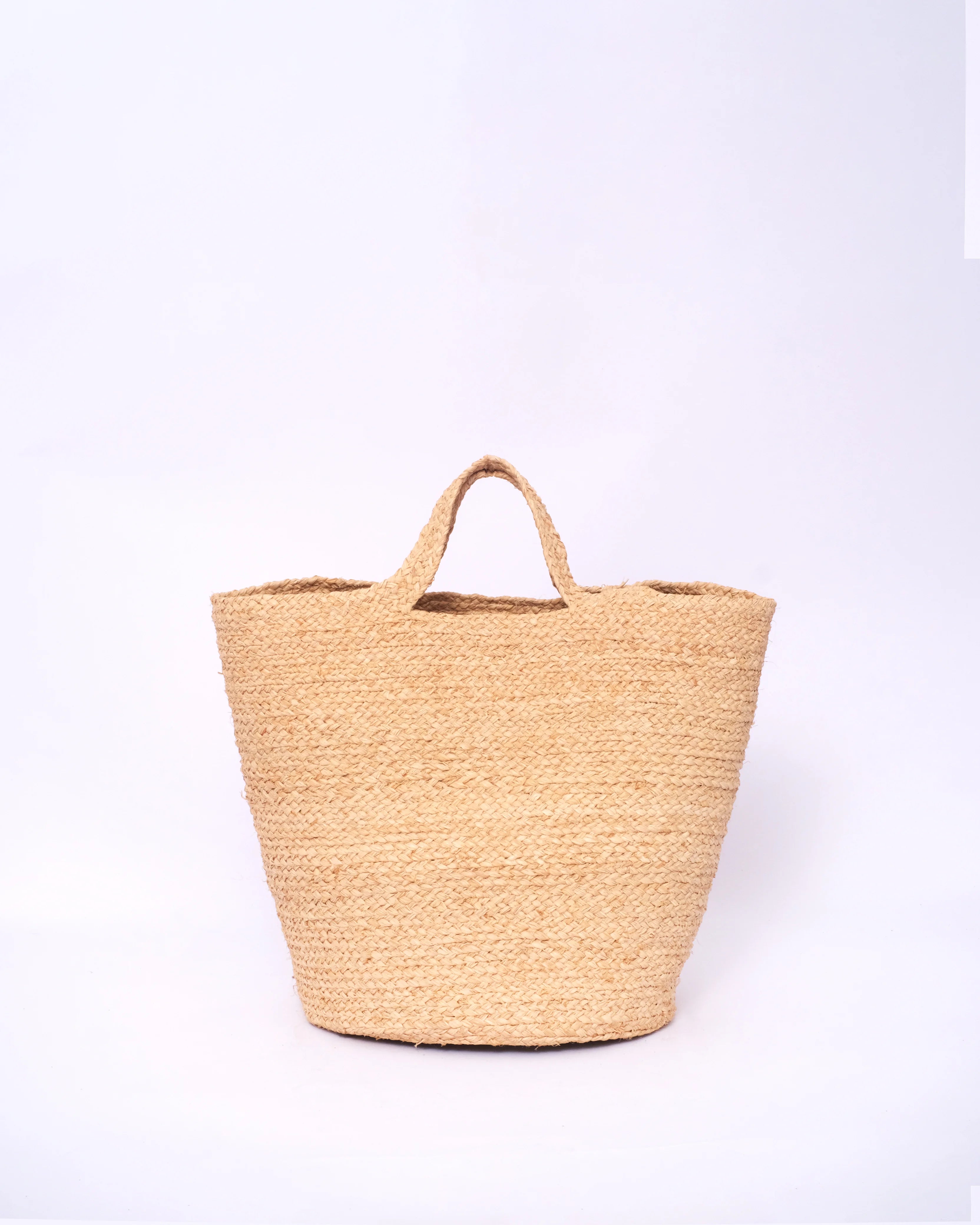 Woven straw bag on a white background